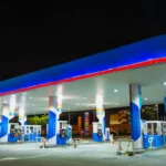 Petrol station forecourt with EV charging bays alongside fuel dispensers, illustrating a petrol station EV charging strategy