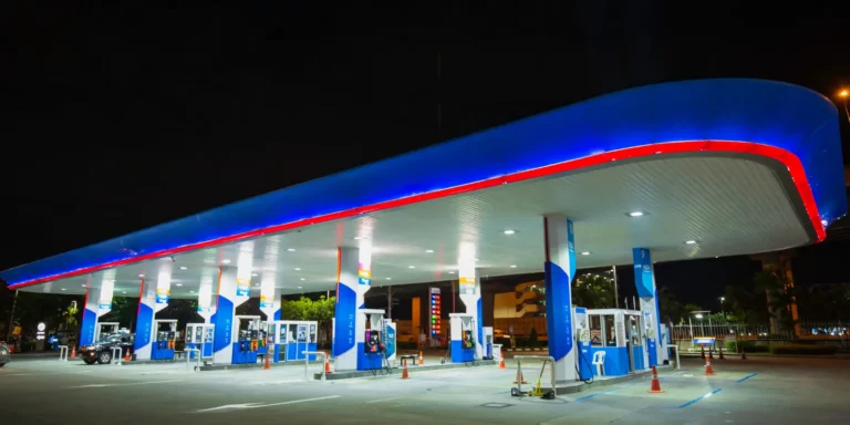 Petrol station forecourt with EV charging bays alongside fuel dispensers, illustrating a petrol station EV charging strategy
