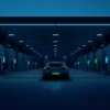 EV charging revenue models - multi-bay EV charging hub with digital screens at dusk