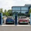 EV charging load management basics — four EV chargers charging vehicles at a commercial charging site